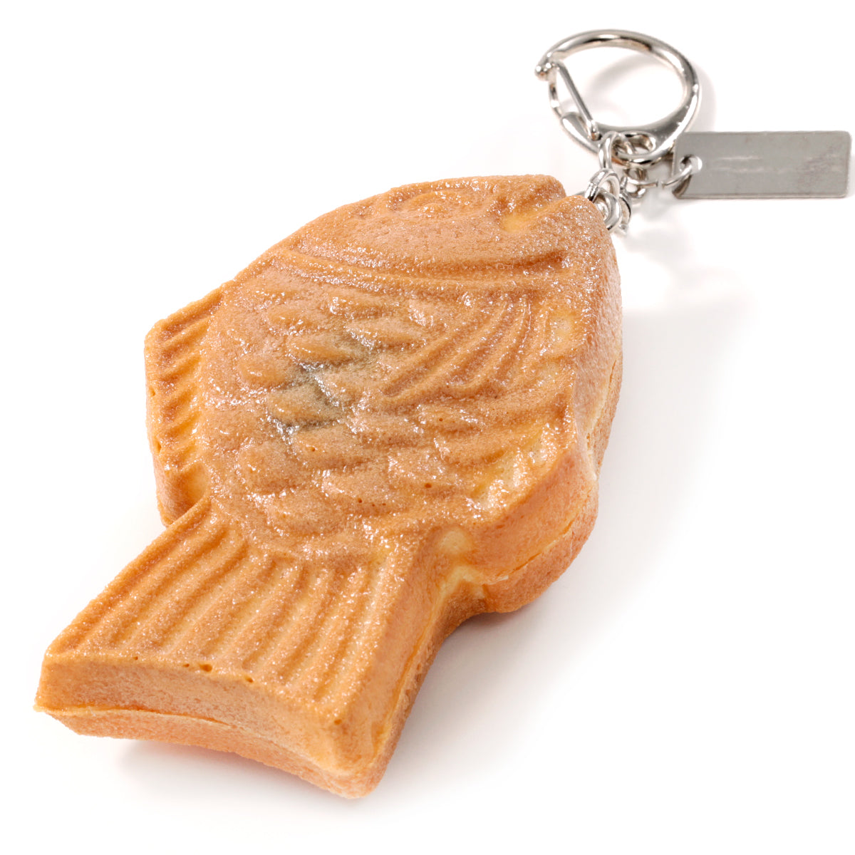 これは元祖食品サンプル屋の「キーリング スマイルたい焼」の商品裏面画像です。