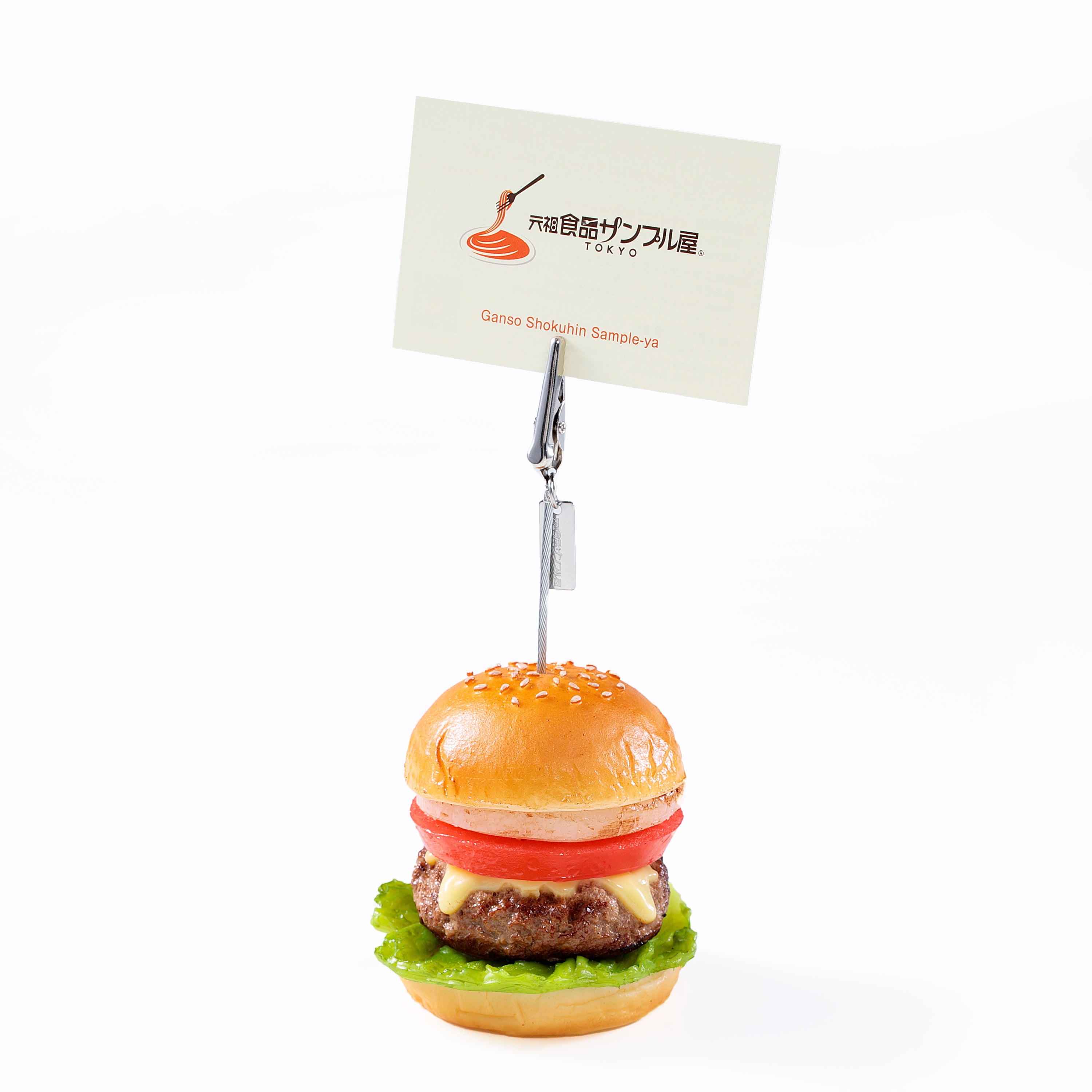 これは元祖食品サンプル屋「ハンバーガー　クリップ」のメモを挟んだ使用イメージ画像です。